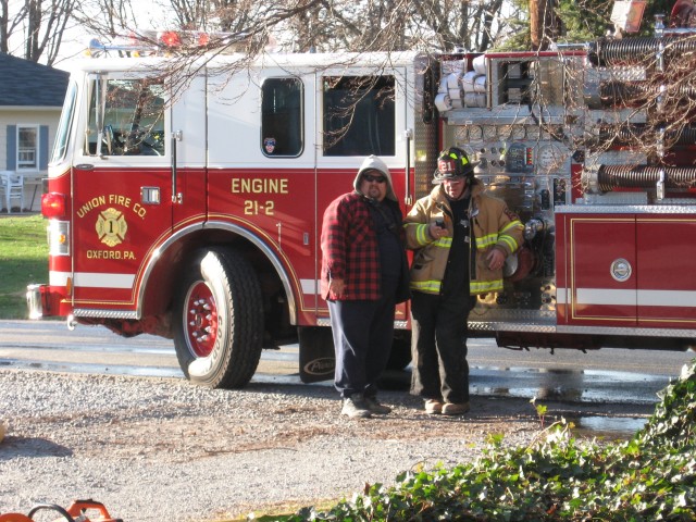 Firefighter Donald Slauch and Past Chief Jim Prettyman discussing a West Grove house fire.